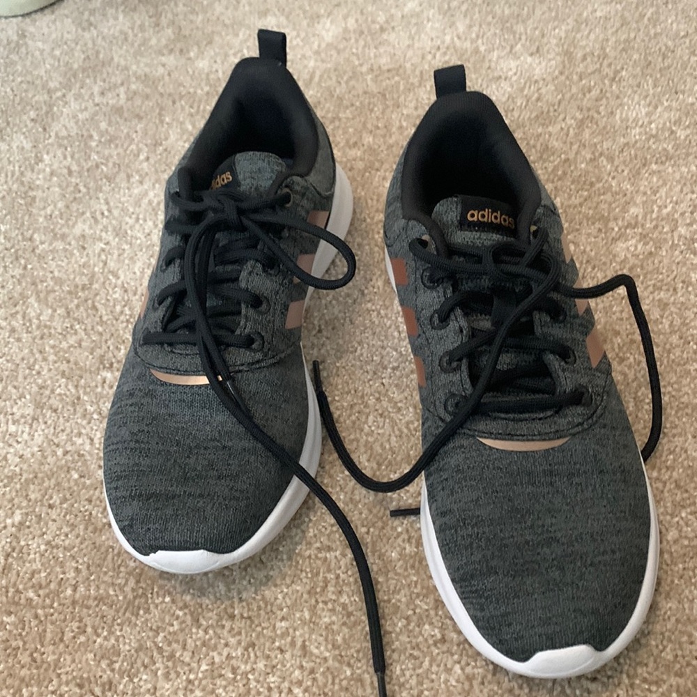 Adidas charcoal tennis shoes with gold metallic on the sides.  Size 8